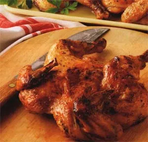 Цыплята табака с глазурью из апельсинов и карри